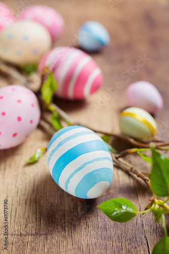 Colorful Easter eggs and branch tree with spring buds