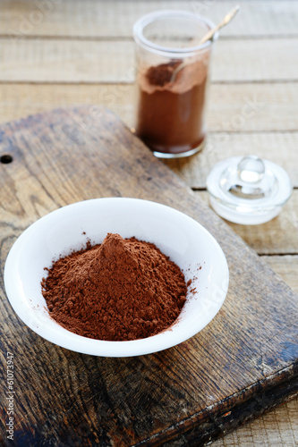 cocoa powder in a bowl and jar