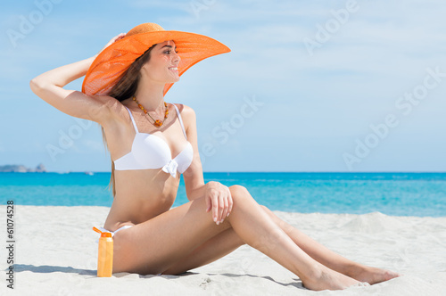 Woman Sitting At Beach