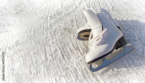 Women white skates. Abstract background on a winter sports theme