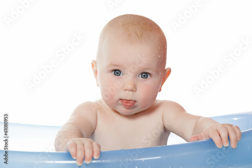 7 months baby girl having bath.