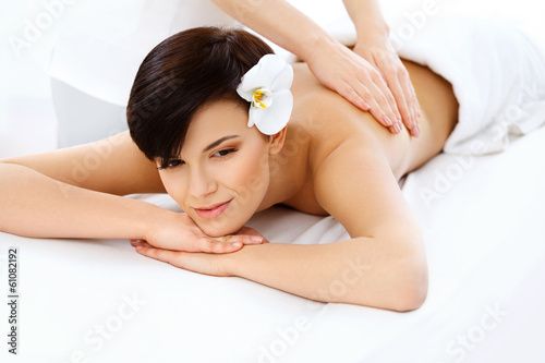 Massage. Close-up of a Beautiful Woman Getting Spa Treatment 