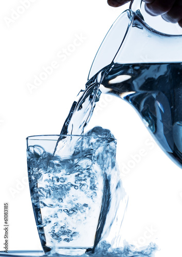 фотографія glass with water and jug