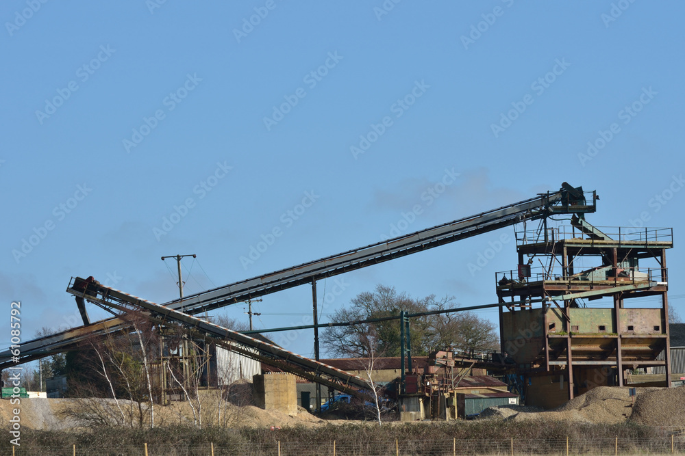 Large gravel extraction equipment with blue sky background Large gravel extraction equipment with blue sky background