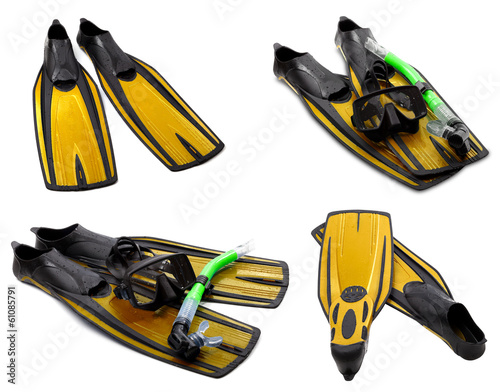 Set of yellow flippers, mask, snorkel for diving with water drop