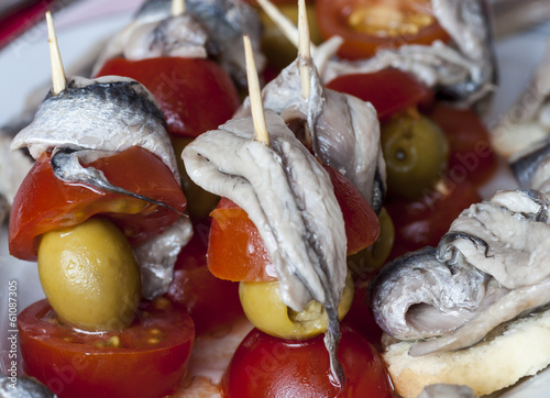 FISH, TOMATOES AND OLIVES photo