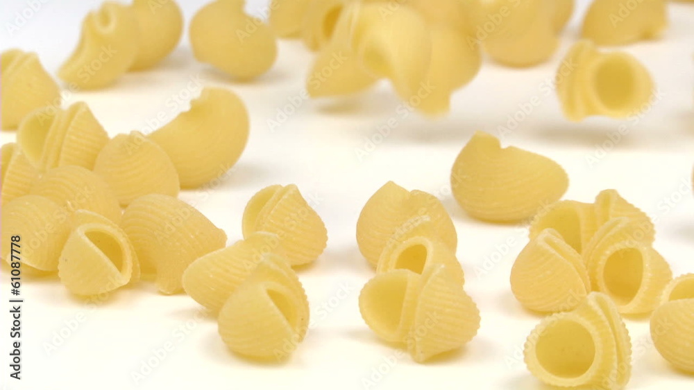 pipe pasta falling and filling the screen in slow motion pipe pasta falling and filling the screen in slow motion