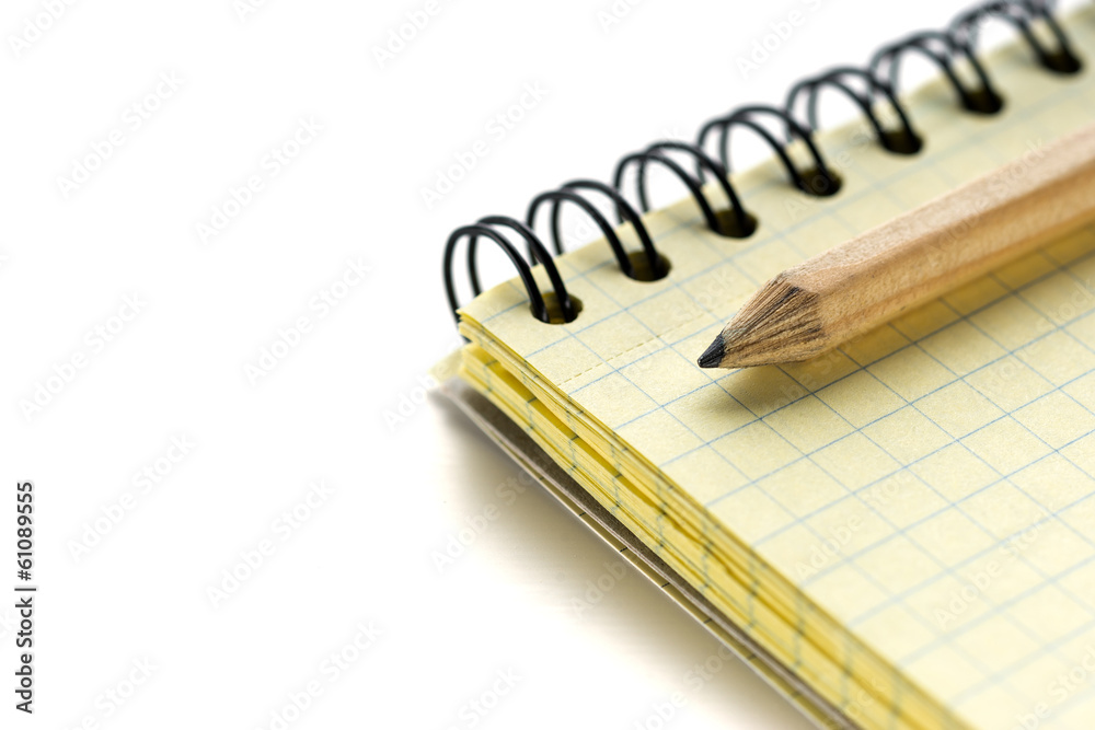 Lead pencil and notebook on white background Lead pencil and notebook on white background
