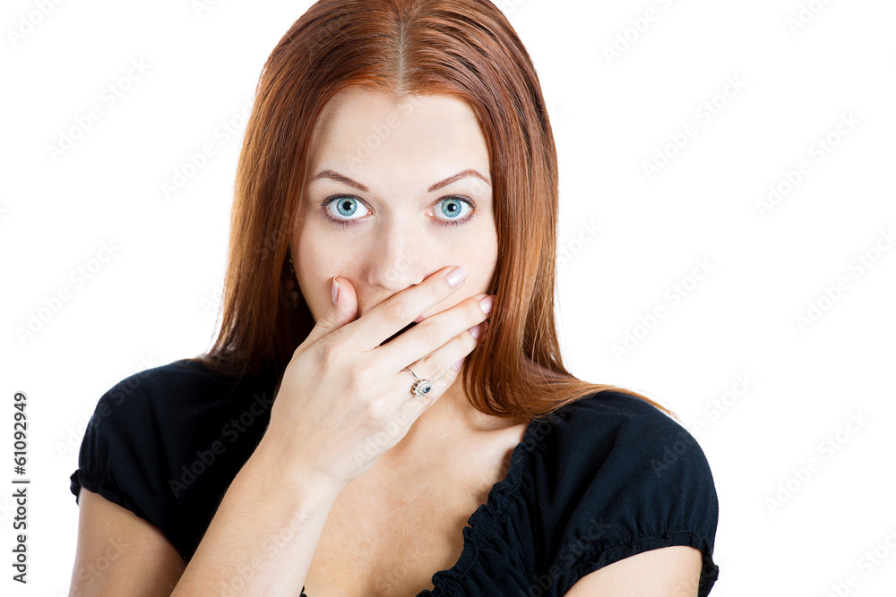 Surprised young woman staring at you