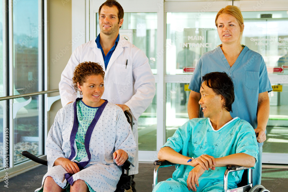 Obraz premium Workers taking two patients for walk