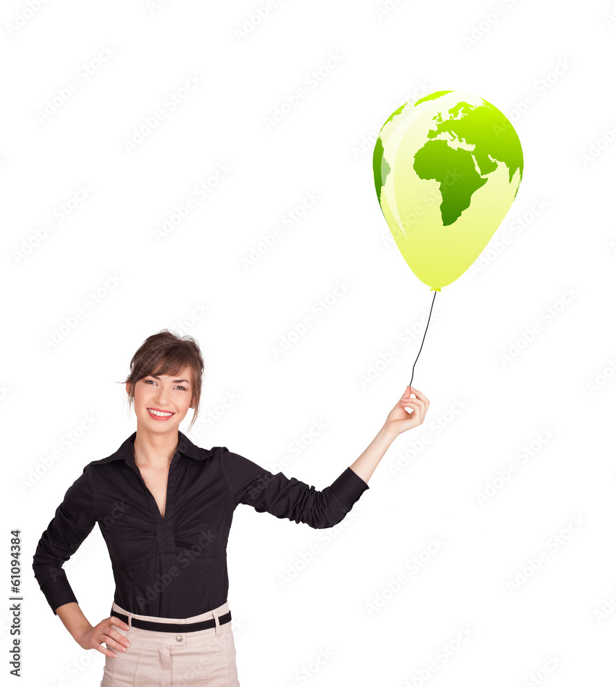 Happy lady holding a green globe balloon Happy lady holding a green globe balloon