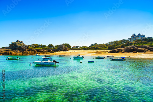 Tablou canvas Tregastel, boats in beach bay. Pink granite coast, Brittany, Fra