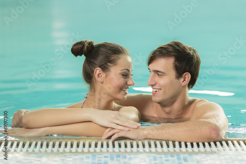 Young couple in the swimmin...