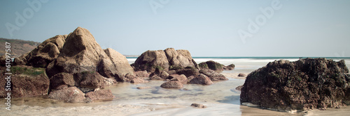 Panorama landscape of rocky coastline at sunset