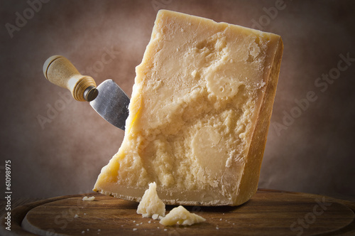 Wallpaper Mural Parmesan cheese cutting on the chopping board Torontodigital.ca