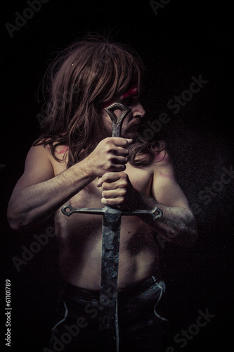 Medieval.savage warrior with iron sword