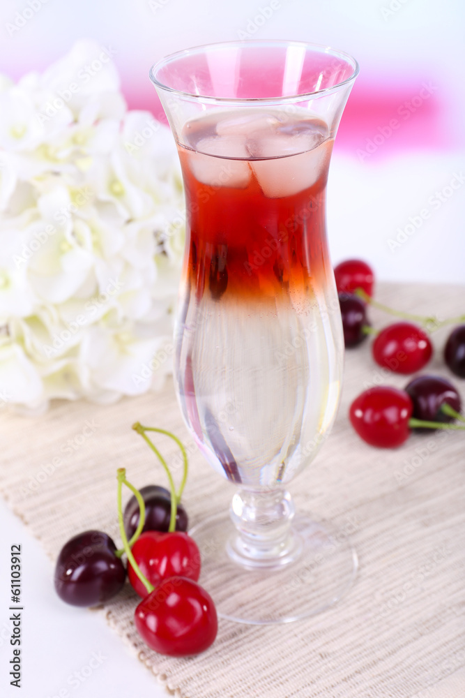 Glass of cocktail on table on light background Glass of cocktail on table on light background