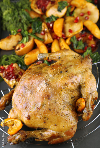 Whole roasted chicken with vegetables and fried potatoes