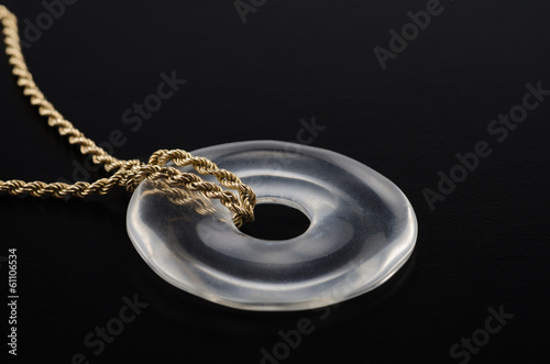 Rock crystal donut on golden chain