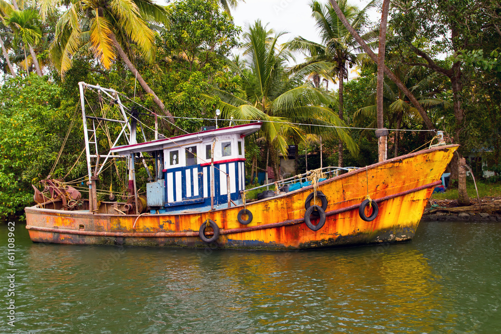 Indian fishing-boat with beautiful reflection in the water Indian fishing-boat with beautiful reflection in the water