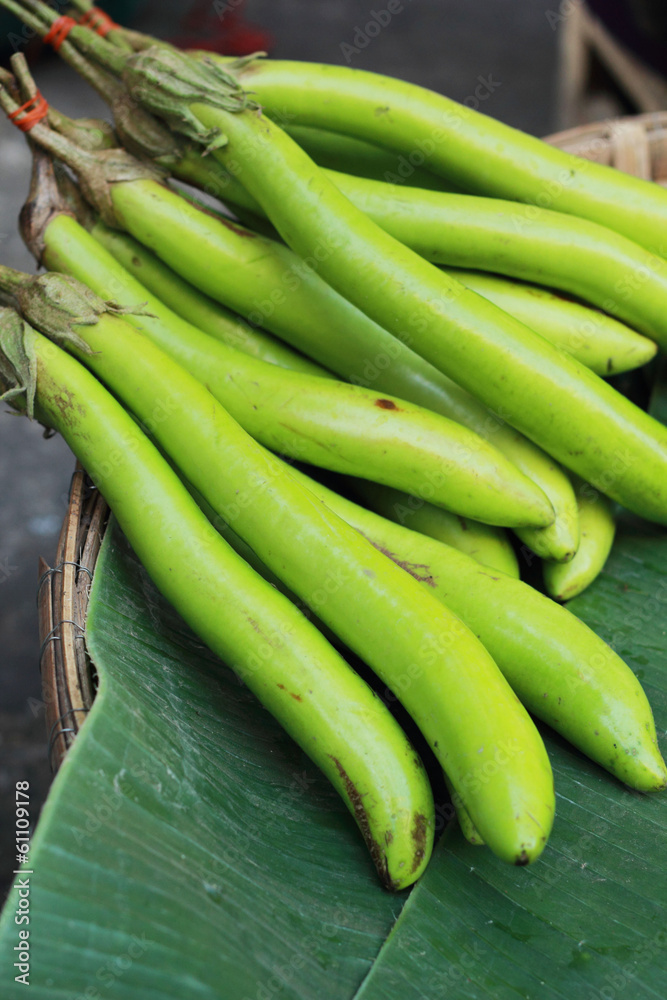 Green long eggplants in the market. Green long eggplants in the market.