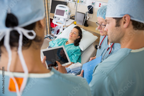 Nurses and Patient in Post Op Unit in Hospital photo