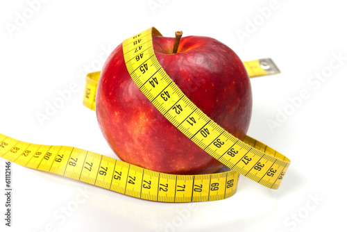 apple with tape on white background (health and diet concept)