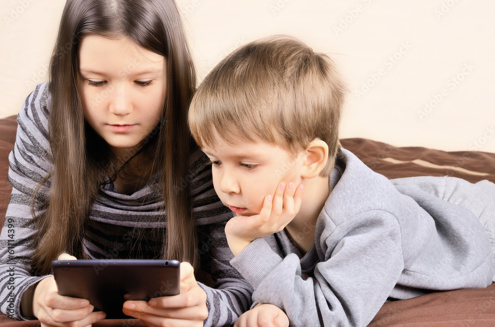 children playing on the tablet horizontal children playing on the tablet horizontal