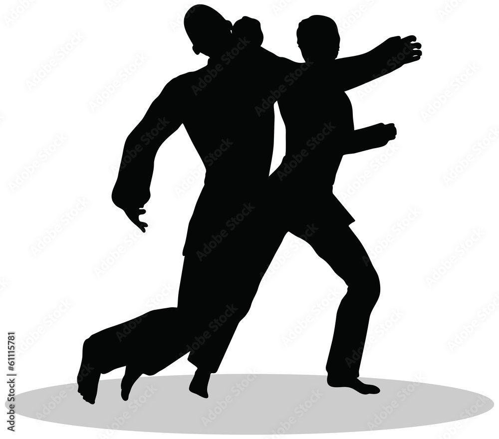 silhouettes of man and woman in karate poses