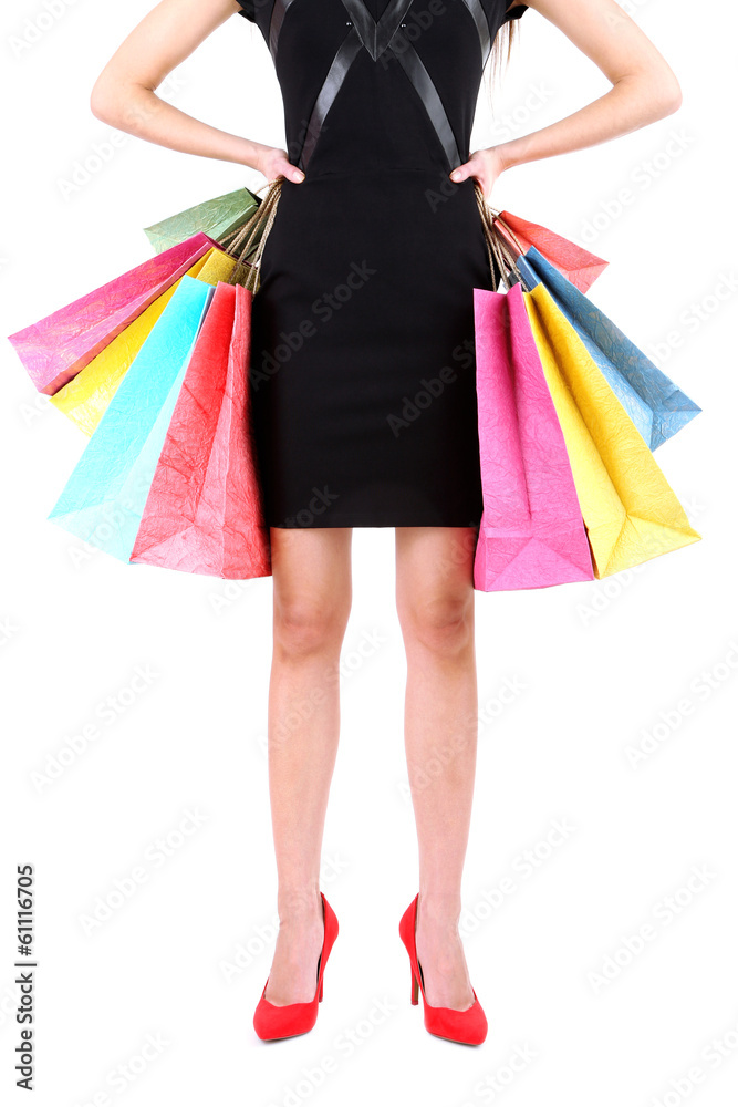 Female in red shoes holding shopping bags isolated on white Female in red shoes holding shopping bags isolated on white