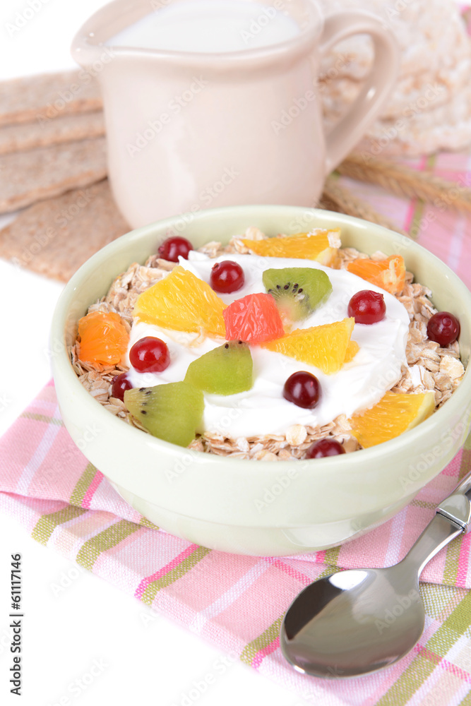 Delicious oatmeal with fruit in bowl on table close-up Delicious oatmeal with fruit in bowl on table close-up
