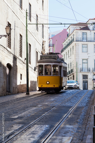 yellow ancient tram on streets of Lisbon, Portugal