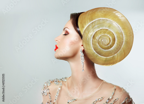 Extreme Hairstyle. Peculiar Woman with Snail. Headwear photo
