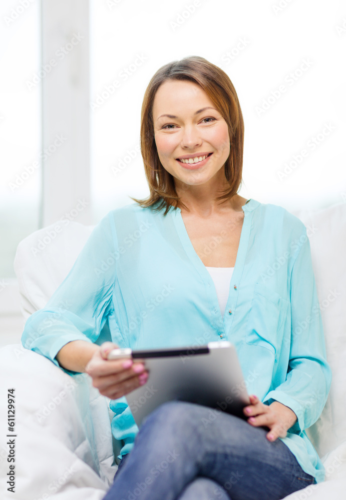 smiling woman with tablet pc computer at home smiling woman with tablet pc computer at home