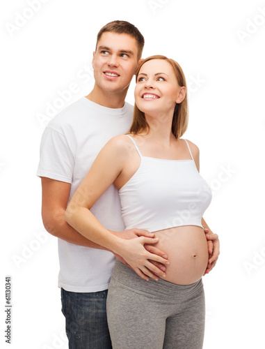 happy young family expecting child