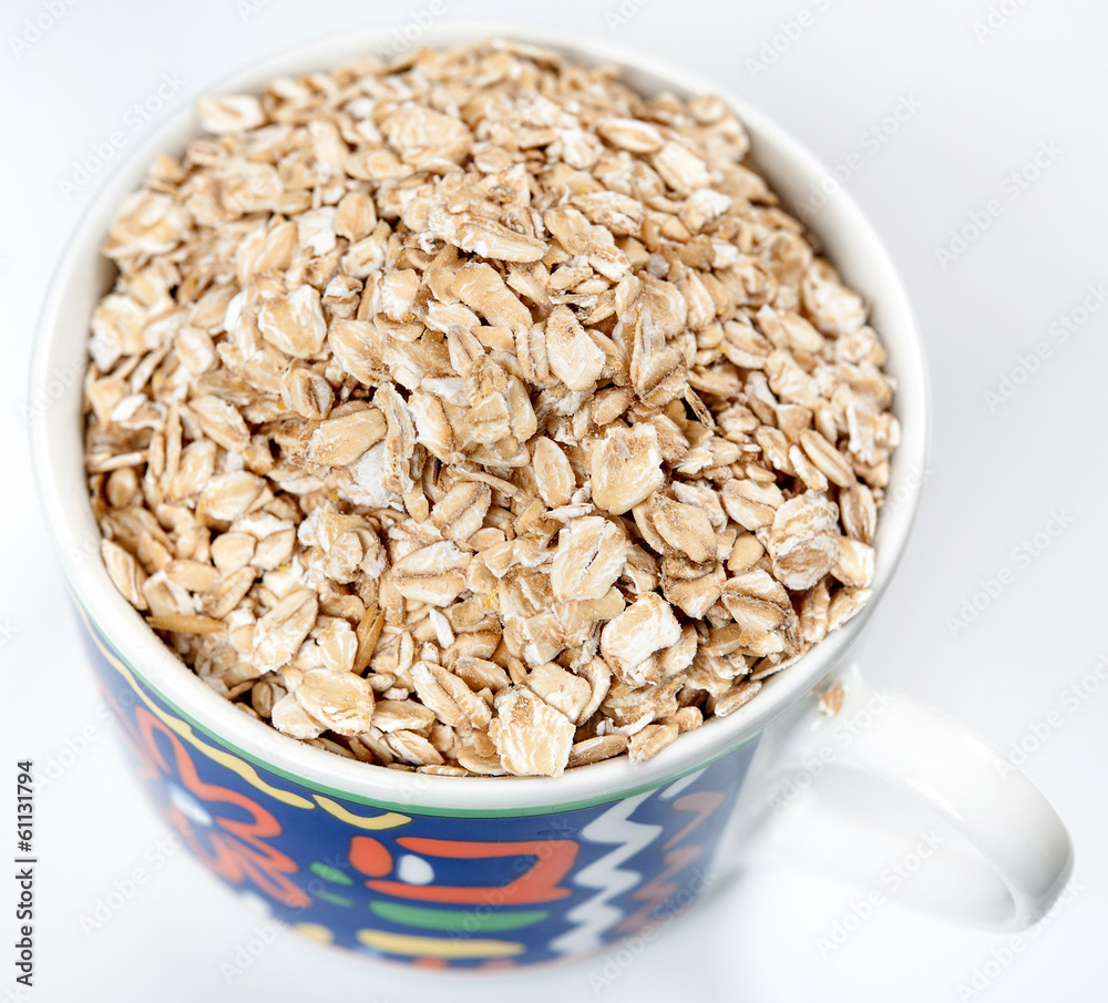 Oatmeal with raisins isolated on a light background Oatmeal with raisins isolated on a light background