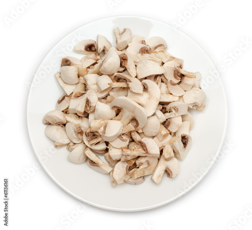 Sliced champignon mushrooms in plate