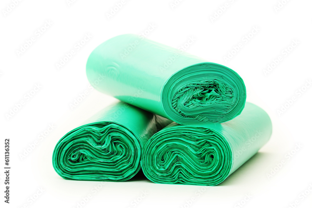 Green garbage bags rolls on a white background Green garbage bags rolls on a white background