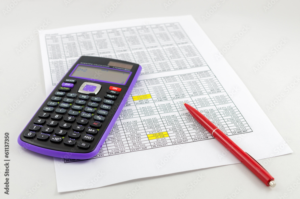 Calculator and pencil on the paper with financial data sheets Calculator and pencil on the paper with financial data sheets