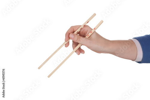 Female hand holding chopsticks with chinese inscription