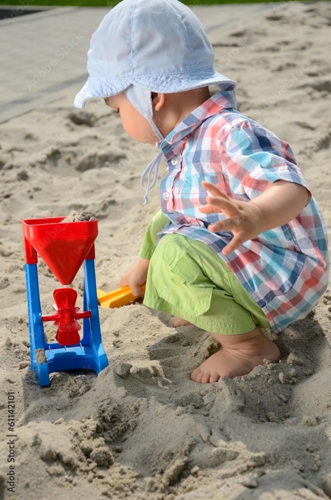 Baby boy in sandpit Baby boy in sandpit