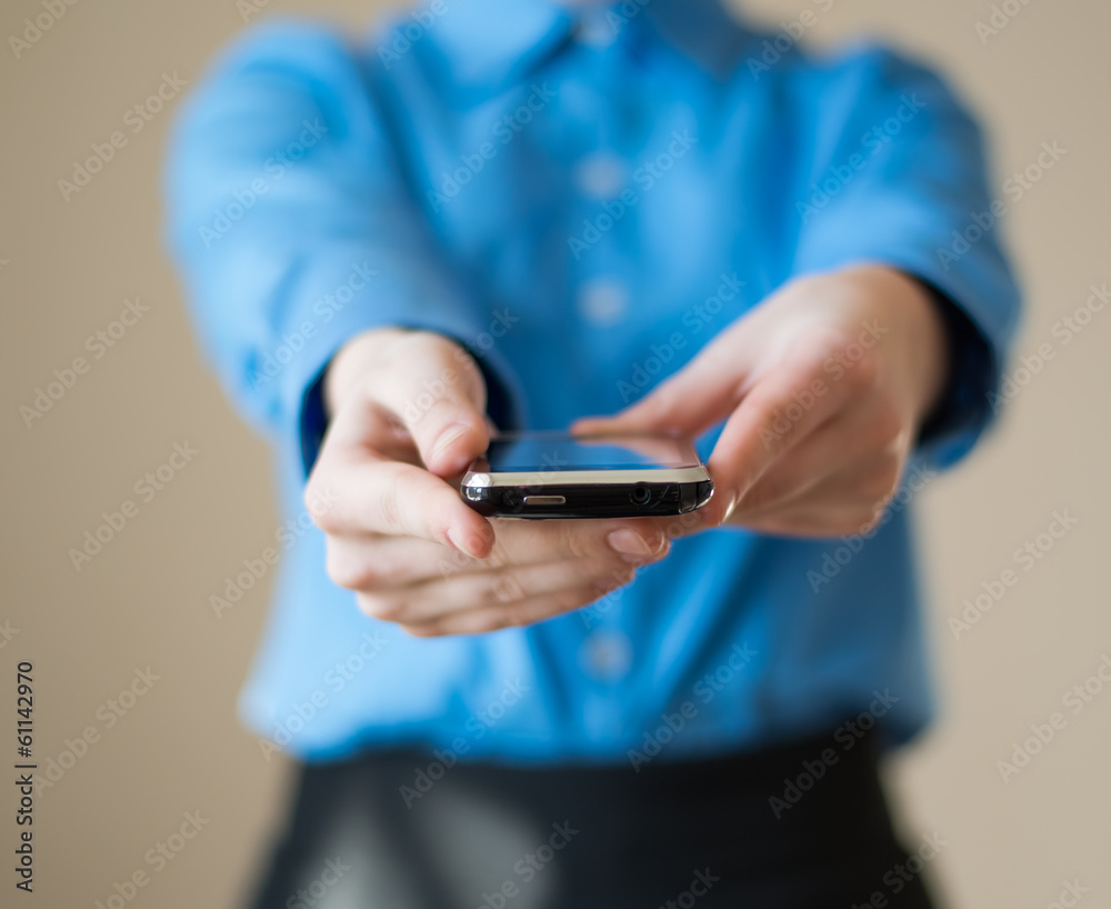 Close up of woman holds mobile smart phone in hands Close up of woman holds mobile smart phone in hands