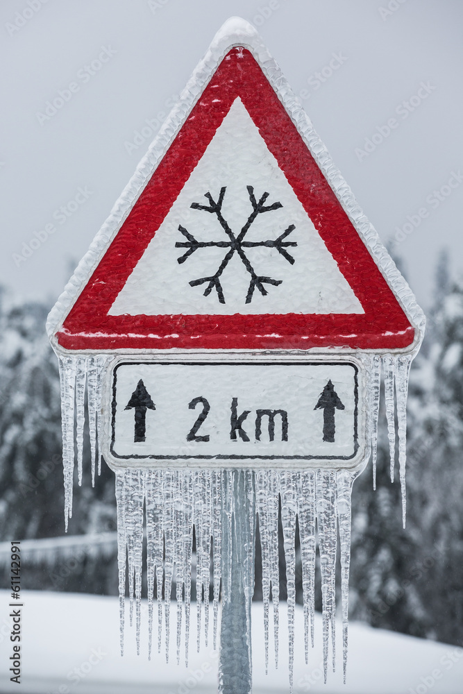 Traffic sign for icy road with icicles