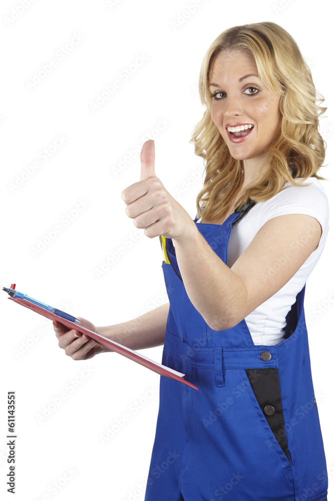 Junge Handwerkerin hebt den Daumen Junge Handwerkerin hebt den Daumen