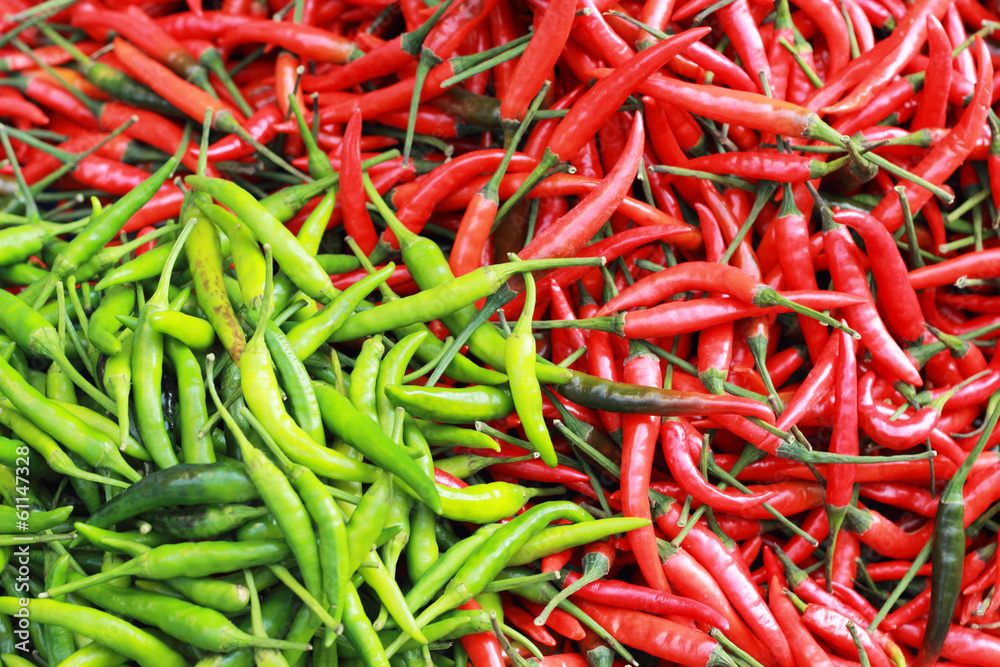 Green chili and red chili on the market.