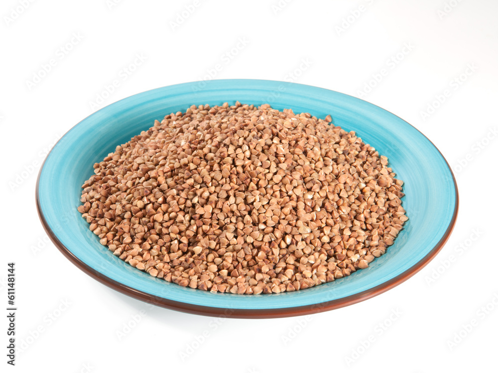 Buckwheat in bowl isolated on white background Buckwheat in bowl isolated on white background