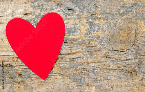 Red heart on a wooden table