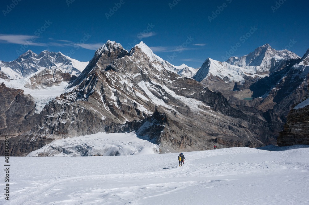 Mountaineers walking on snow in Himalayas of Nepal