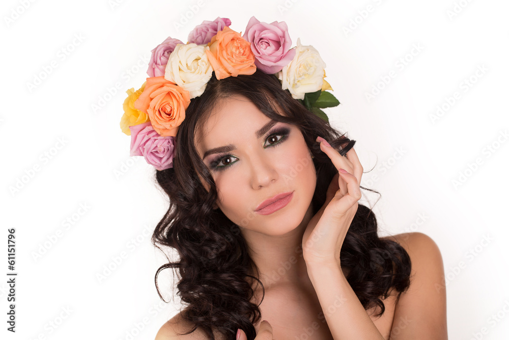 Beautiful young woman with floral wreath. Fashion shot. 