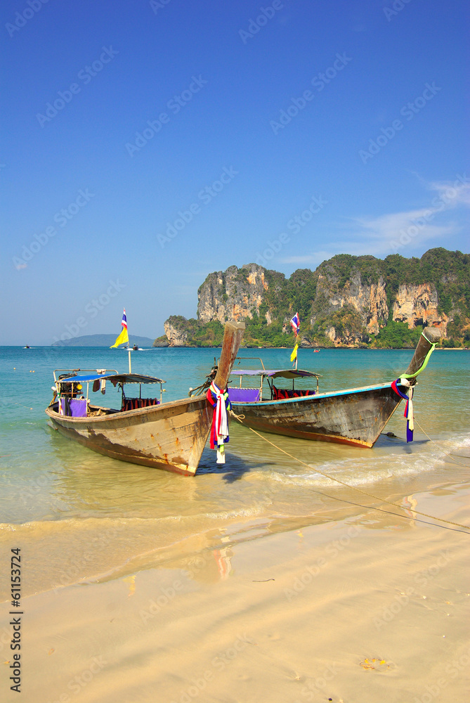 Traditional Thai boat on Railay beach, Krabi, Thailand Traditional Thai boat on Railay beach, Krabi, Thailand